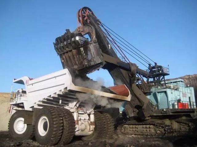 Electric shovel and truck